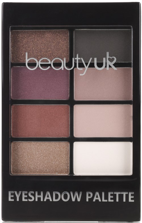 En sminkpalett med sex ögonskuggor i ett svart skal, märkt 'Eyeshadow Palette' och 'beauty uk.'