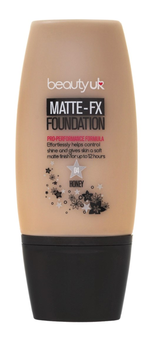 En beige flaska av beauty uk matte-fx foundation med svart lock, märkt som honey nyans, dekorerad med stjärnor och blommor.