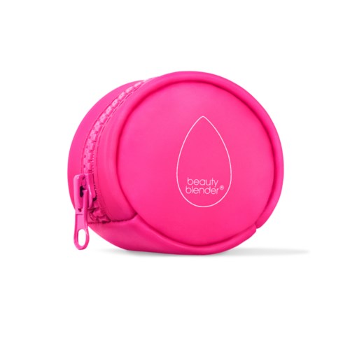 Pink round case with a zipper and the logo 'beauty blender' on it.
