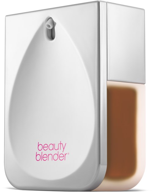 En vit enhet med spraymunstycke och rosa text som säger "beauty blender" på den, med en brunn svamp fäst.