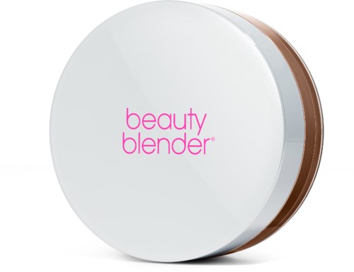 A round, white beauty blender makeup sponge with pink text and a brown bottom edge.