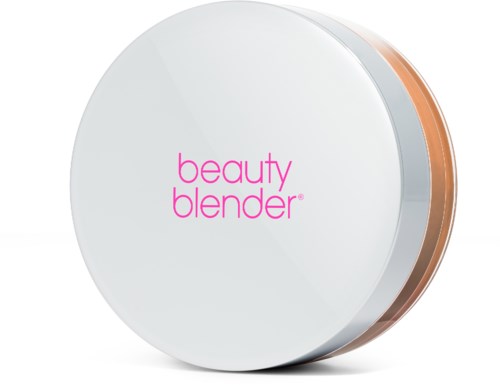 En rund vit enhet märkt 'beauty blender' med en persikofärgad kant.