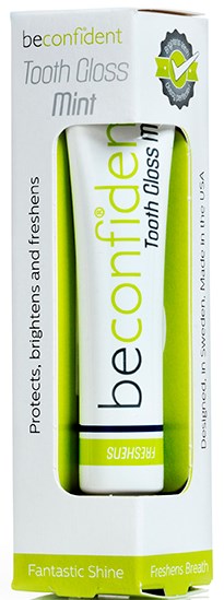 En hvit og grønn tannkremtube i en eske, merket "be confident" og "tooth gloss mint".
