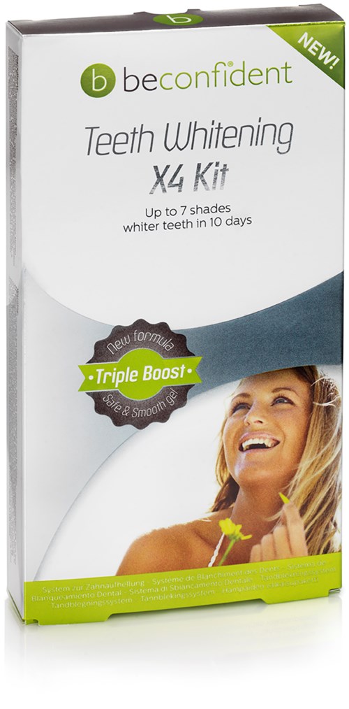 En eske med teksten 'Teeth Whitening X4 Kit' med en smilende kvinne, grønne detaljer og nevner tannbleking på 10 dager.
