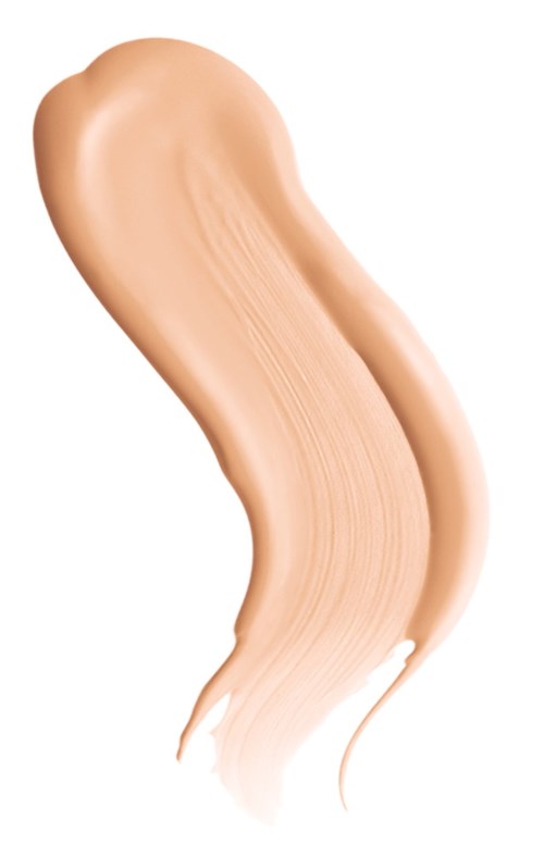 En virvla av ljusbeige flytande, slät och krämig, sannolikt en foundation eller concealer.