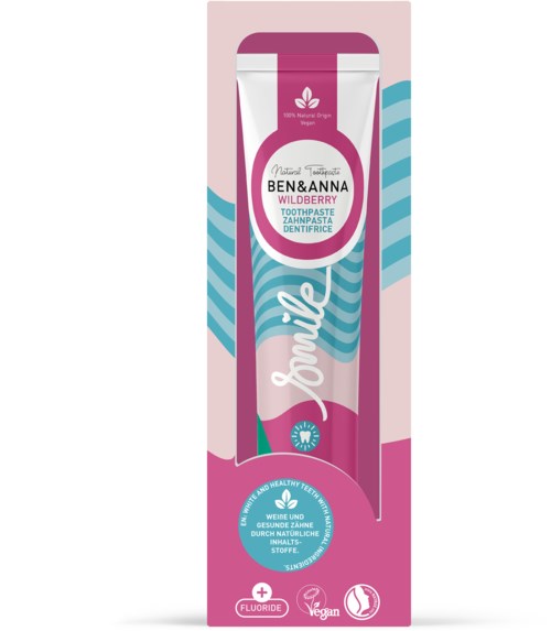 Zahnpasta namens 'Jomile' mit rosa und blauer Verpackung, mit natürlichen Zutaten, vegan und fluoridfrei.