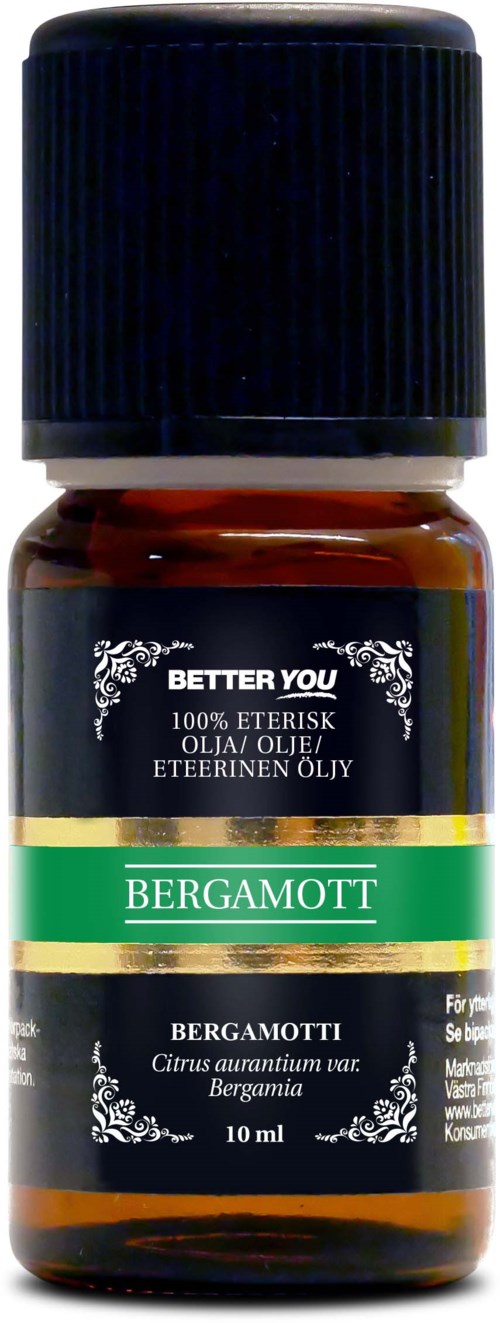 A small amber bottle of bergamot essential oil with a black cap and a green, black, and gold label.