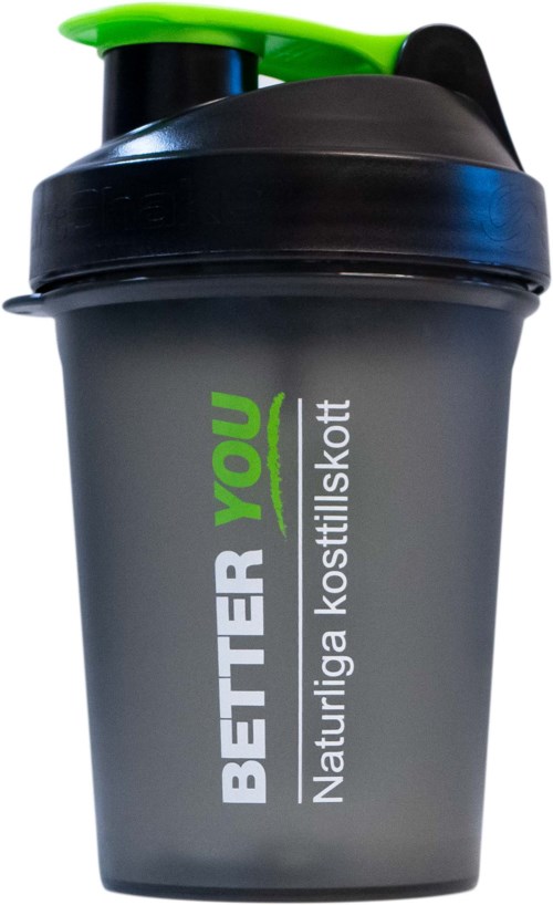 En mörkgrå shakerskål med grönt lock och pip, med texten "BETTER YOU" och andra detaljer.