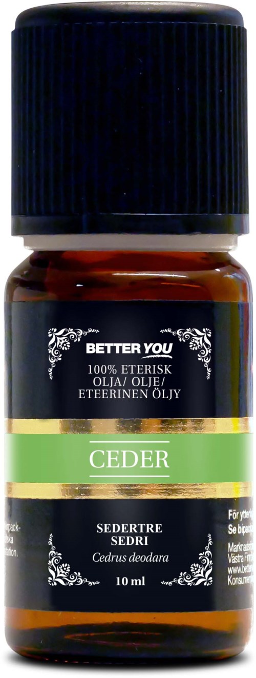 Liten bärnstensfärgad flaska med svart lock, märkt 'Ceder' och 'Cedrus deodara', cederträolja.