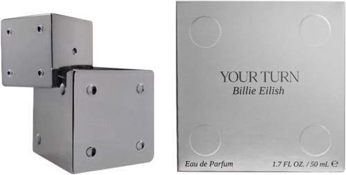 En parfymflaska i form av sammanlänkade metallkubor och en låda med parfymnamnet "YOUR TURN" av Billie Eilish.