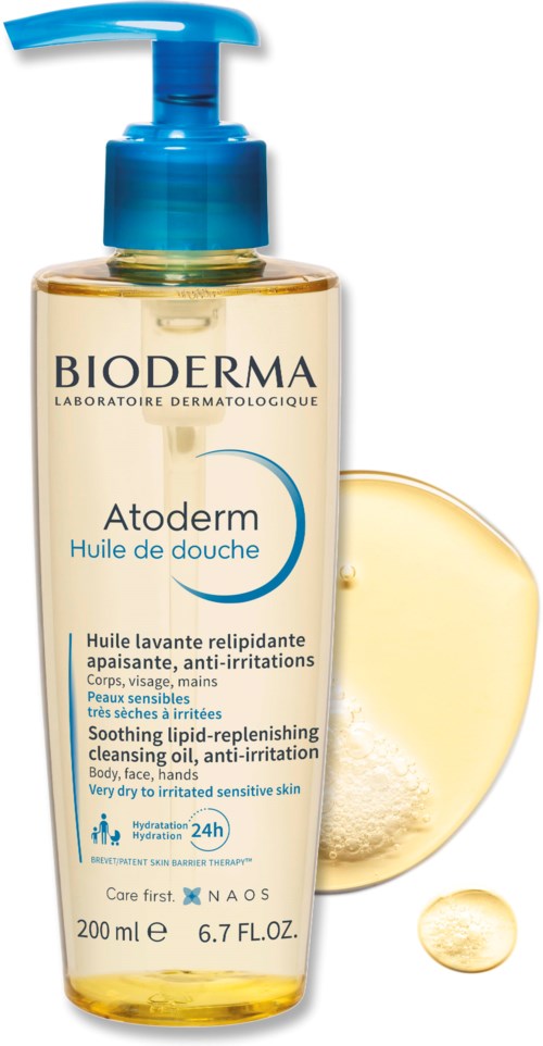 Läpinäkyvä pullo sinisellä annostelijalla, merkattu 'Bioderma Atoderm' rauhoittavaan ihoon, erityisesti erittäin kuivalle ja herkkäihoiselle.
