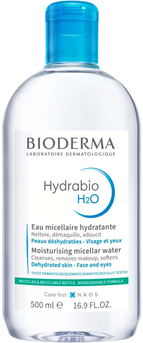 En klar plastflaske med blå lokk, merket Hydrabio H2O, for å fukte og rengjøre hud og øyne.