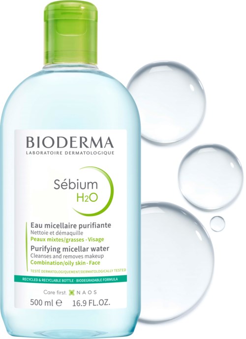 Bioderma Sébium H2O purifying micellar water for face, with green cap, cleaning oily skin, with bubbles around.