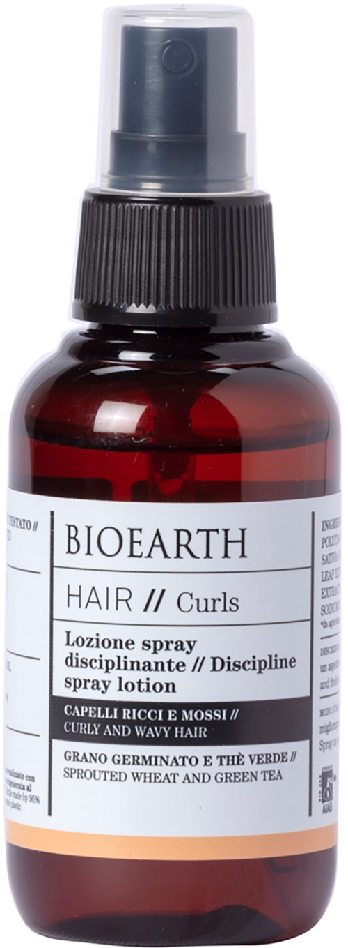 En mörkbrun flaska med spraylock, märkt Bioearth hårspray för lockar, innehållande vete och grönt te.