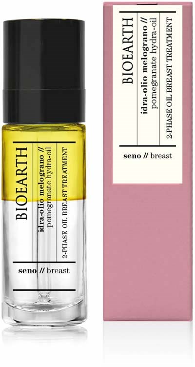 En liten glasflaska med gul olja och svart lock, bredvid en rosa förpackning, båda märkta 'Bioearth'.