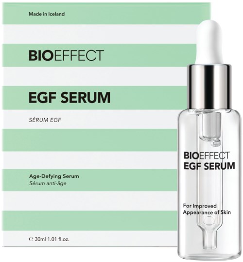 En ansiktsserum i en klar flaska med en vit dropper, märkt för anti-aging och hudförbättring.