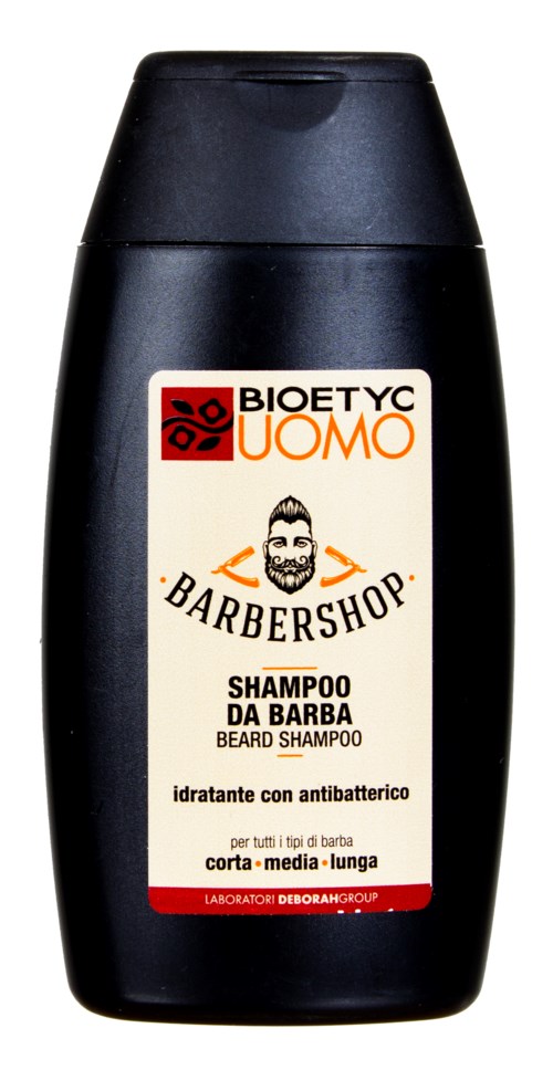 En svart flaska med en etikett som säger Bioety Uomo Beard Shampoo, för rengöring av skägg och antibakteriell användning.