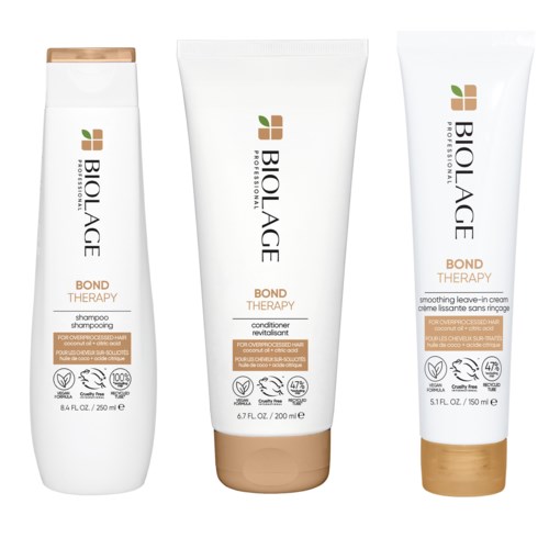Three white hair care bottles with green, brown, and black text, labeled as Biolage Bond Therapy for hair treatments.