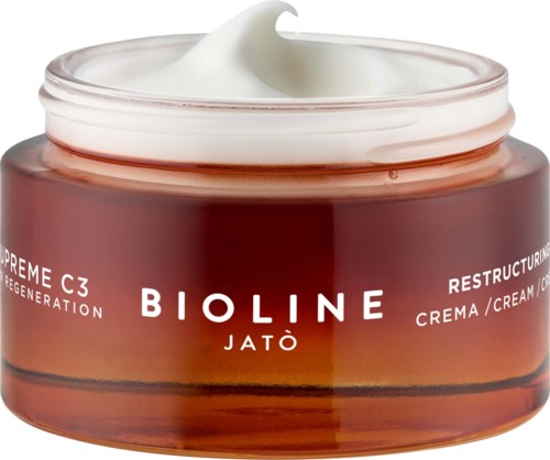 A jar of Bioline Jatò cream with white cream on top, labeled for skin restructuring and regeneration.