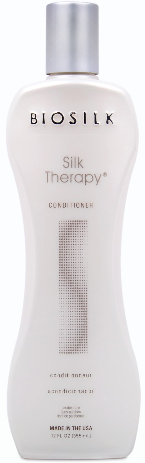 En vit flaska med silverlock märkt BIOSILK, Silk Therapy, Balsam, tillverkad i USA.