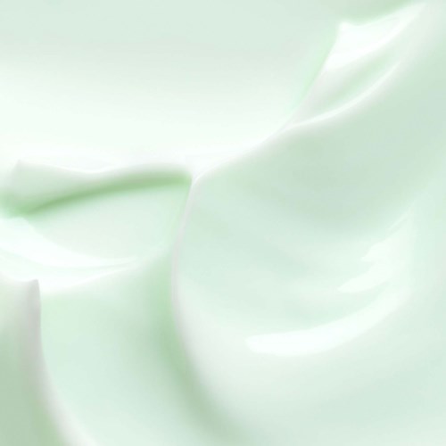 Smooth light green cream with soft swirls and shine.