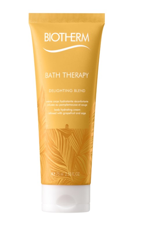 Eine gelbe Tube mit weißem Deckel, beschriftet Biotherm Bath Therapy, mit Palmblättern.