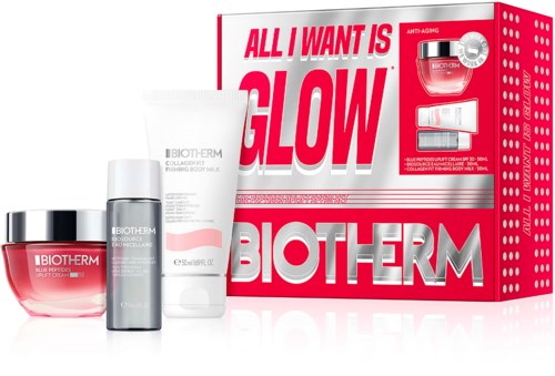 Samling av hudvårdsprodukter med en röd och vit Biotherm-box som säger allt jag vill ha är glow, inklusive kräm, serum och gel.