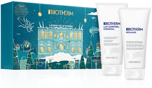 Et Biotherm hudpleie gaveeske med to hvite rør og en festlig blå eske med vinterdesign.