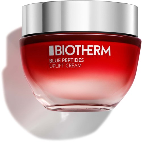 A red jar with a silver lid labeled 'Biotherm Blue Peptides Uplift Cream' shines in light.
