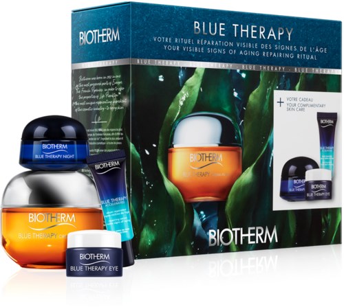 Ett hudvårdsset med krämer och ögon gel i tre burkar, på förpackningen finns ett naturinspirerat mönster och en box märkt Blue Therapy.