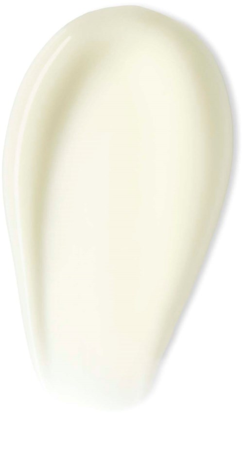 En klick vit kräm eller lotion på en vit bakgrund.