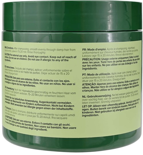Dette er en grøn shampoo-beholder med brugsanvisning på flere sprog.