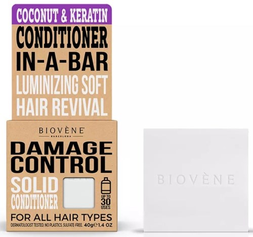 Verpakking met tekst voor haarconditioner, genoemd kokos, keratine, schadecontrole en zachte haarvernieuwing.