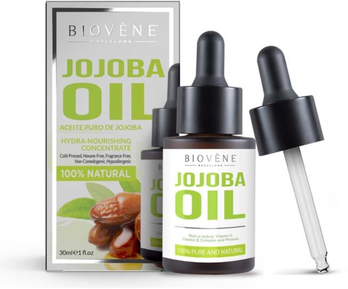 Flaska och förpackning med jojobaolja och pipett, etiketten säger 100% naturlig och ren, för hud och hår.