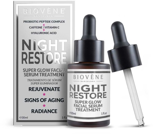 A box and bottle of skincare serum for night use, with ingredients like probiotics, caffeine, vitamin C, and hyaluronic acid.