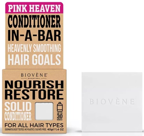 Dozen met roze en beige haarverzorgingsproducten met vetgedrukte zwarte en witte tekst. Bevat een klein wit doosje.
