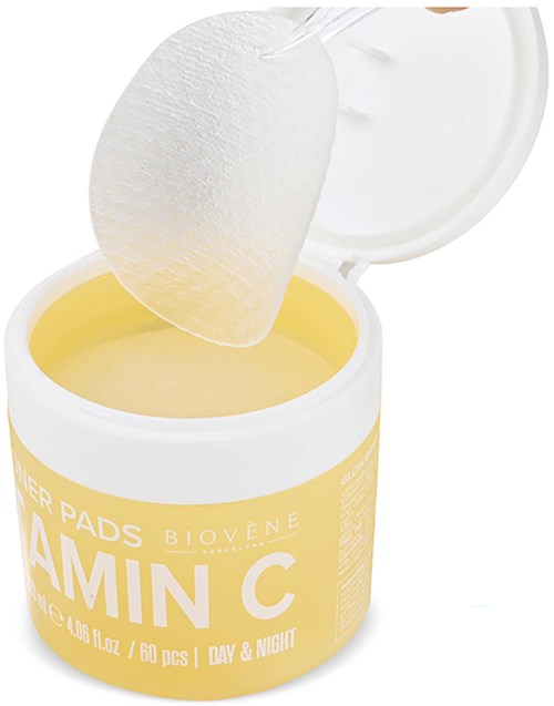 A container of Biovene Vitamin C face pads with an open lid and a pad partially pulled out.