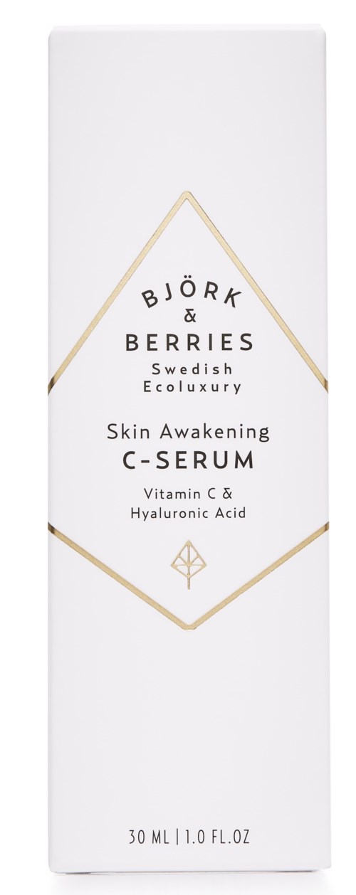 En hvit eske med gullfargede linjer, merket Bjork & Berries Skin Awakening C-Serum med vitamin C og Hyaluronsyre.