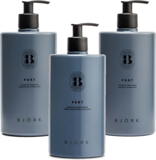 Tre blå flasker med pump, mærket til hårplejeprodukter, står i række.