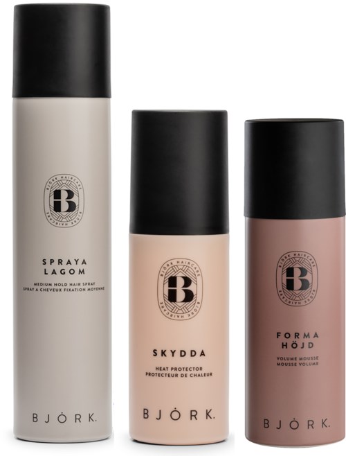 Three hair care products in black, white, and pink bottles with black caps, with brand and product names on labels.