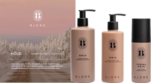 Bjork haircare products with a pink background, three bottles, and black caps, branding visible on each bottle.