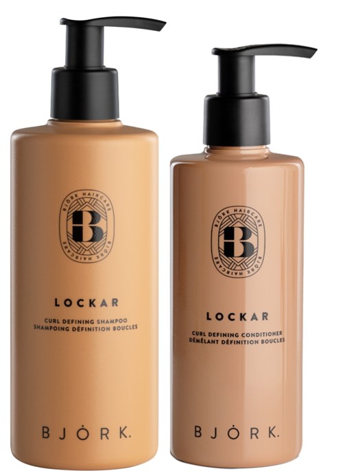 Two brown bottles with black pump dispensers, labeled for shampoo and conditioner, from Bjork, Lockar series.