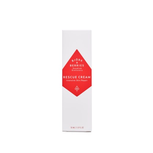 En vit box med en röd diamantetikett. Den står Bjork & Berries Rescue Cream för hudreparation.
