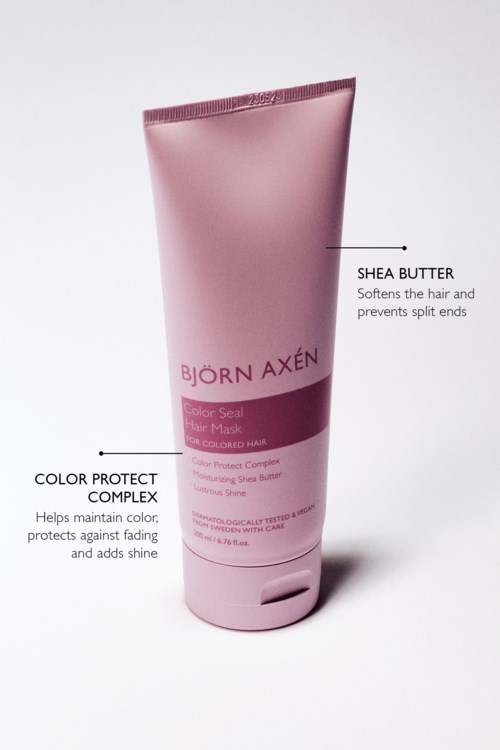 En rosa tube med hårmaske som forklarer shea smør og fargebeskyttelse.