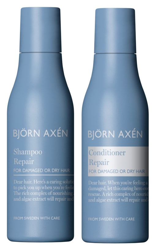 Två blå flaskor med Björn Axén schampo och balsam för skadat eller torrt hår.