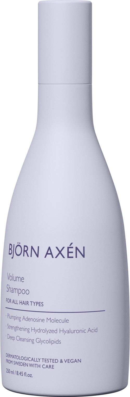 En hvit flaske med Bjorn Axen volum sjampo for alle hårtyper. Den inneholder ingredienser som hyaluronsyre og glyserider.