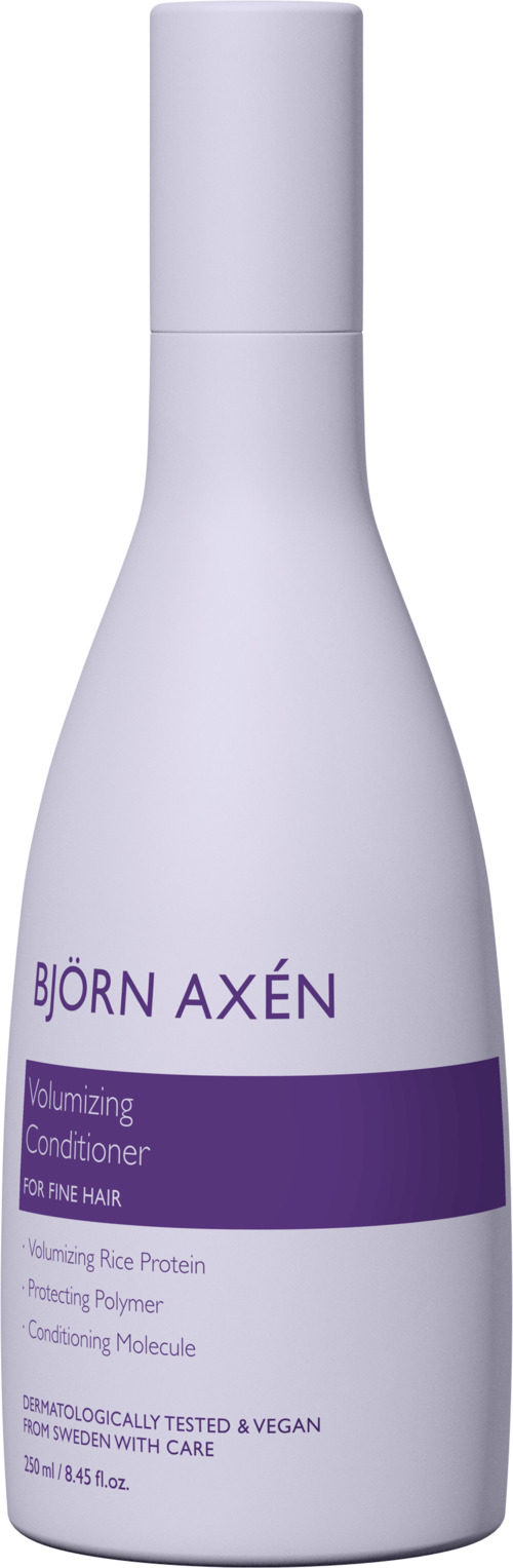 En hvit flaske med lilla etikett som sier Björn Axén, beroligende balsam for hår, vegansk, testet og dyrevennlig.