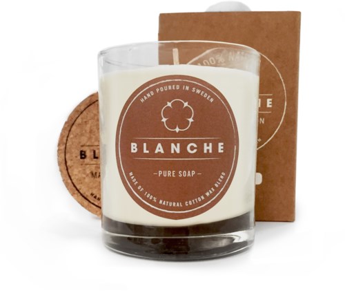 En vit doftljus i en glasbeholder, märkt 'BLANCHE Pure Soap', med en box och tvålpuck bredvid.