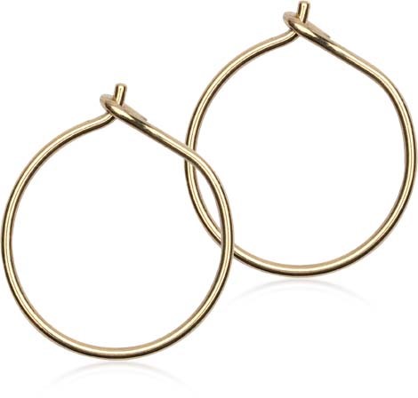 A pair of gold hoop earrings with simple, round design and small hooks.