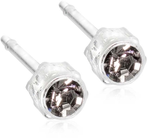 A pair of clear stud earrings with shiny, faceted stones inside. Simple jewelry design.
